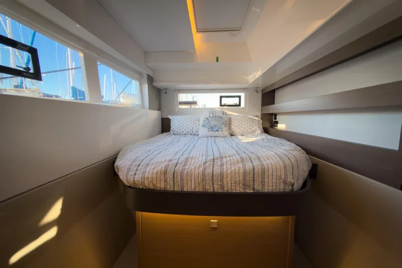 Panthera Yacht Photos Pics Luxurious cabin interior of 2021 Leopard 42 yacht with cozy bed and modern design.