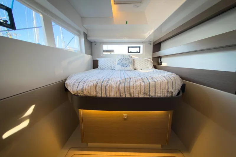 Panthera Yacht Photos Pics Luxurious bedroom interior of 2021 Leopard 42 yacht with modern design and cozy bedding.