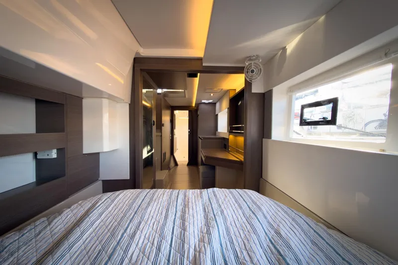 Panthera Yacht Photos Pics Luxurious interior of 2021 Leopard 42 yacht, featuring modern bedroom design and ambient lighting.