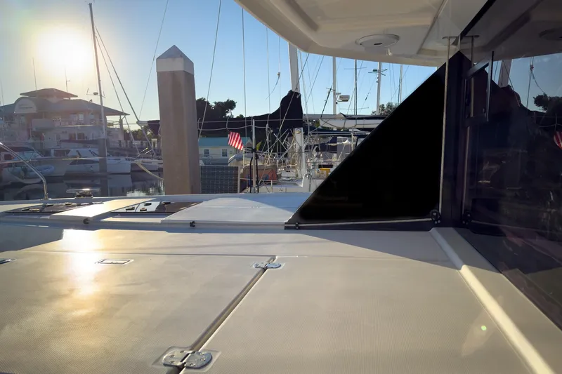 Panthera Yacht Photos Pics 2021 Leopard 42 yacht docked at marina during sunset, showcasing sleek design and modern features.