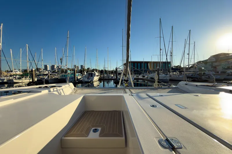 Panthera Yacht Photos Pics 2021 Leopard 42 yacht docked at marina, surrounded by sailboats under clear blue sky.