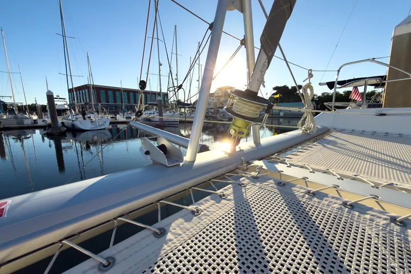 Panthera Yacht Photos Pics Leopard 42 catamaran docked at marina, sun setting behind masts, 2021 model.
