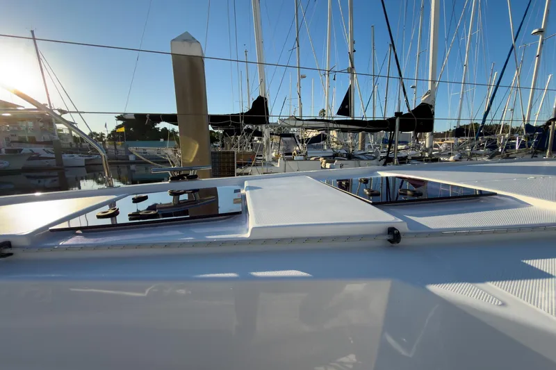 Panthera Yacht Photos Pics Sailing yacht Leopard 42, 2021 model, docked at marina with clear blue sky.