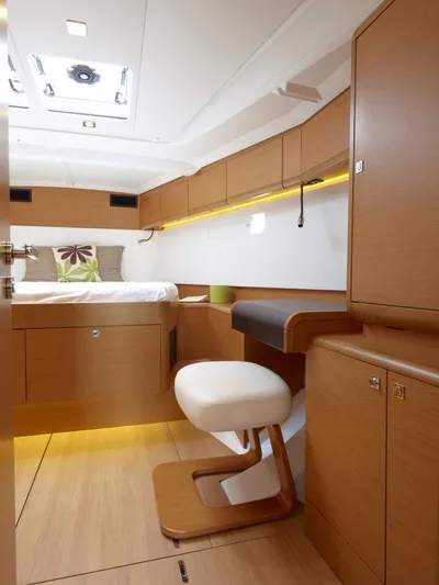 Fortuna Yacht Photos Pics Manufacturer Provided Image: Modern interior of 2016 Jeanneau Sun Odyssey 519 yacht with wooden furnishings.