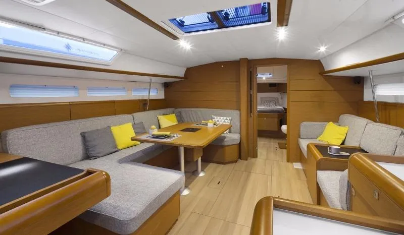 Fortuna Yacht Photos Pics Manufacturer Provided Image: Modern interior of 2016 Jeanneau Sun Odyssey 519 sailboat with cozy seating and dining area.