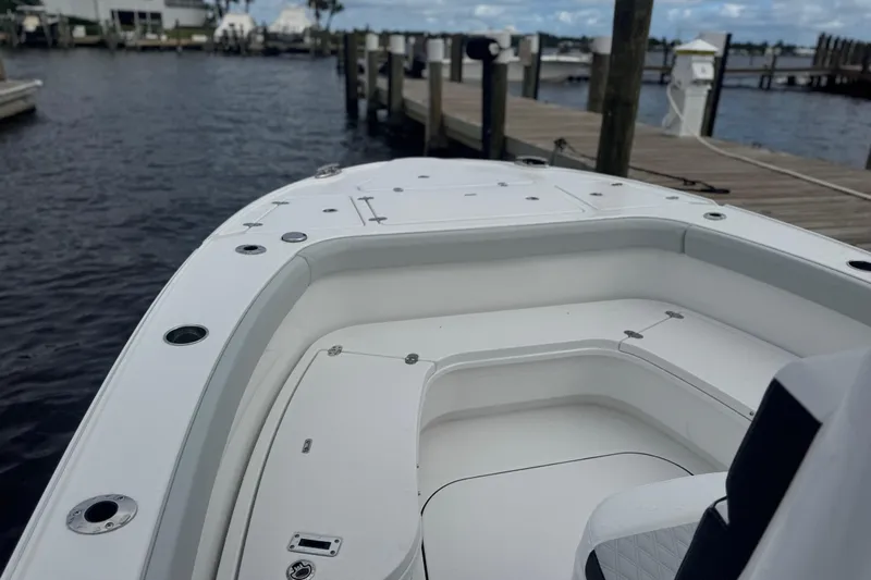 Your Next Boat! Yacht Photos Pics 2026 Blackfin 262 HB boat interior at a marina dock.