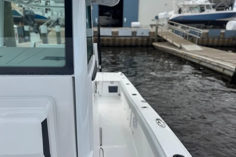 Your Next Boat! Yacht Photos Pics 2026 Blackfin 262 HB boat docked at marina, showcasing sleek design and modern features.