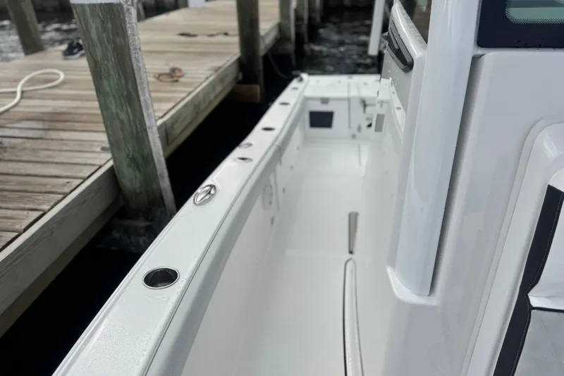 Your Next Boat! Yacht Photos Pics 2026 Blackfin 262 HB boat docked, showcasing sleek white deck and modern design.