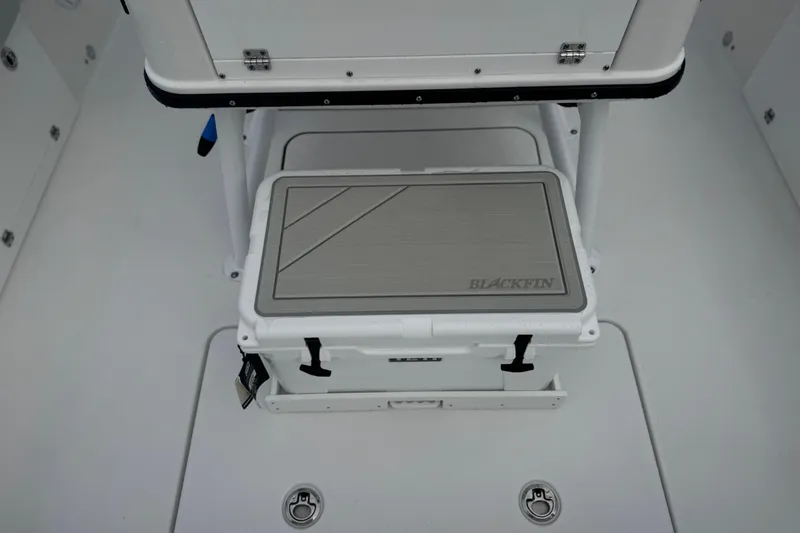 Your Next Boat! Yacht Photos Pics 2026 Blackfin 262 HB boat interior with branded cooler and storage area.
