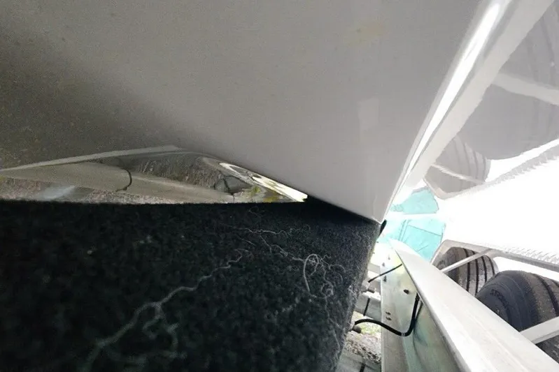 Your Next Boat! Yacht Photos Pics Close-up of 2026 Blackfin 262 HB boat hull on trailer.