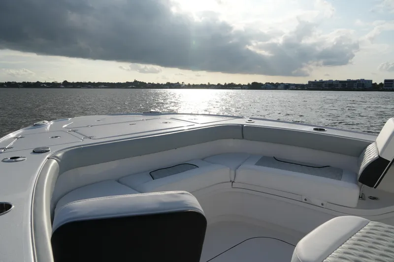 Your Next Boat! Yacht Photos Pics 2026 Blackfin 262 HB boat on calm water under cloudy sky.