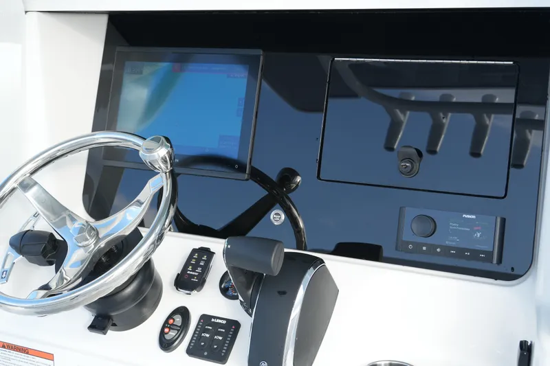 Your Next Boat! Yacht Photos Pics 2026 Blackfin 262 HB helm with modern controls and touchscreen display.