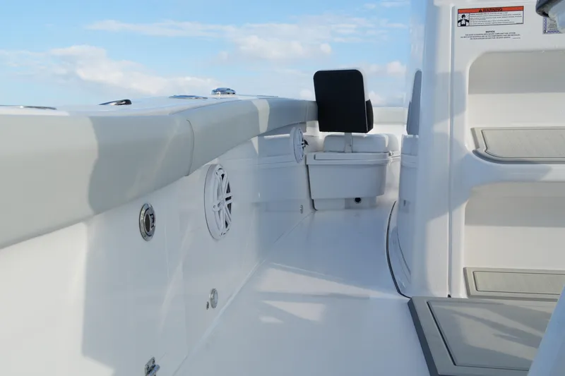 Your Next Boat! Yacht Photos Pics 2026 Blackfin 262 HB boat interior with seating and speaker, under a clear sky.