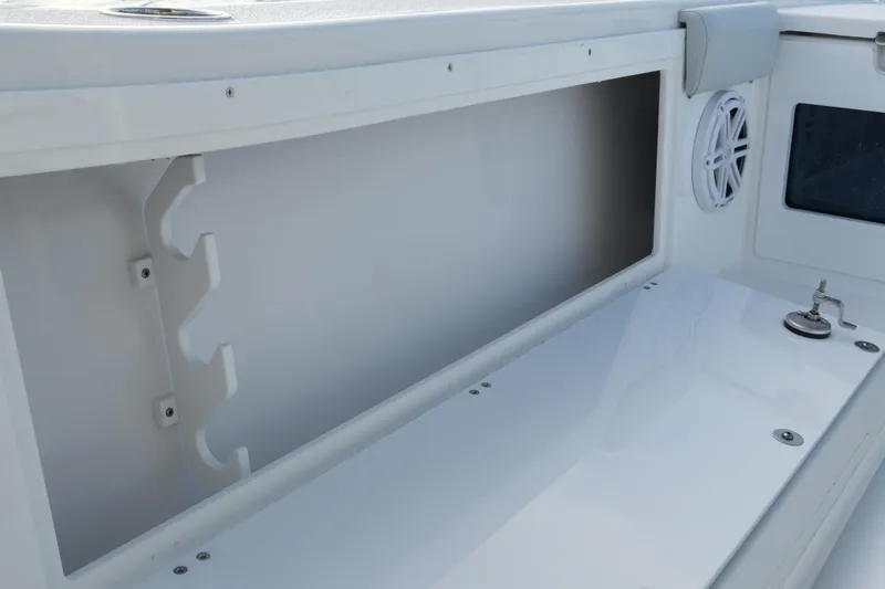 Your Next Boat! Yacht Photos Pics Interior view of 2026 Blackfin 262 HB boat storage compartment and speaker.