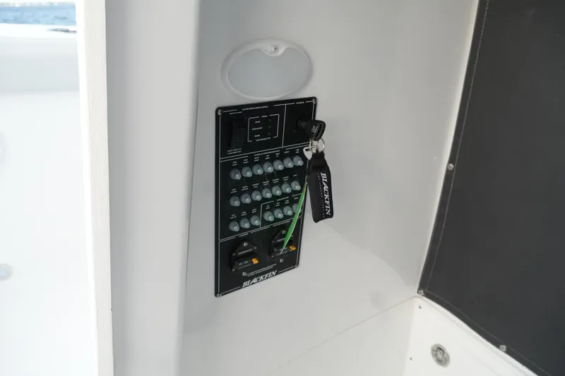Your Next Boat! Yacht Photos Pics Control panel of 2026 Blackfin 262 HB boat with key and switches.