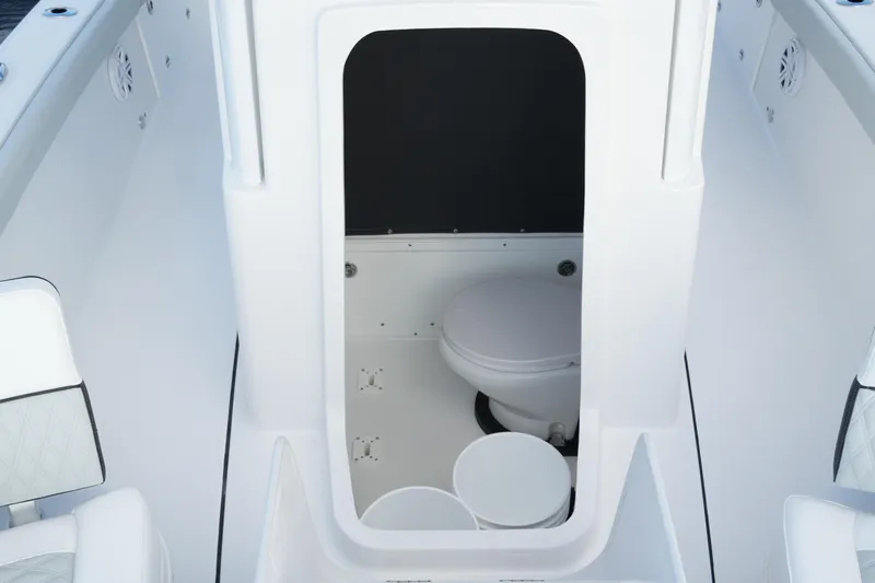 Your Next Boat! Yacht Photos Pics 2026 Blackfin 262 HB boat interior with compact marine toilet.