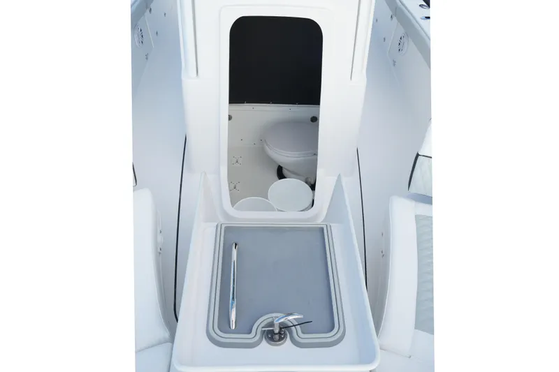 Your Next Boat! Yacht Photos Pics 2026 Blackfin 262 HB boat interior with sink and toilet compartment.