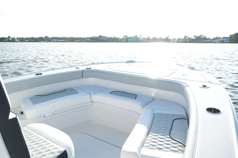 Your Next Boat! Yacht Photos Pics 2026 Blackfin 262 HB boat interior with white seating on calm water.
