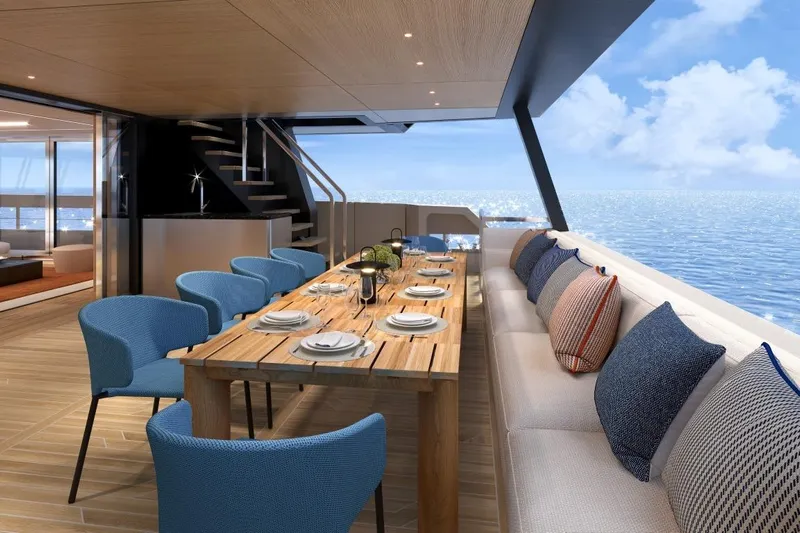  Yacht Photos Pics Luxurious dining area on 2026 Silver Yachts SC22M, featuring ocean views and elegant seating.