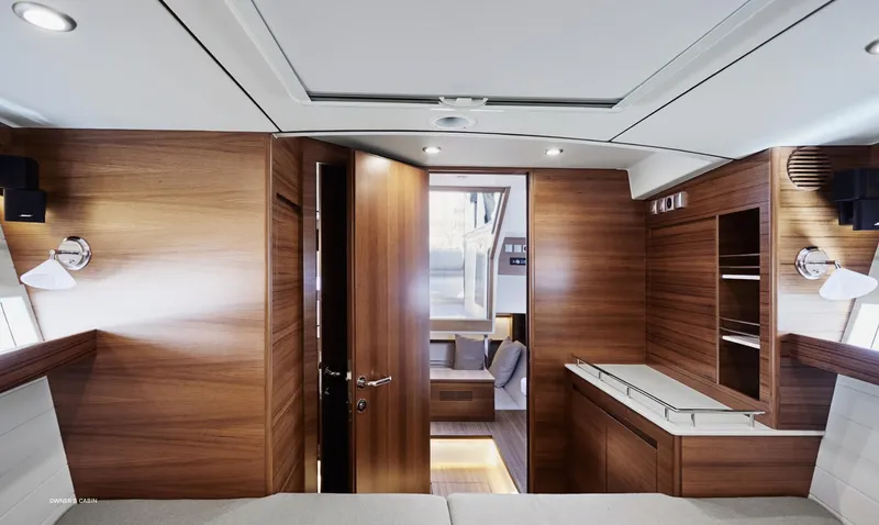  Yacht Photos Pics Interior of 2023 Delta Powerboats 33 Coupe, featuring modern wood finishes and sleek design.