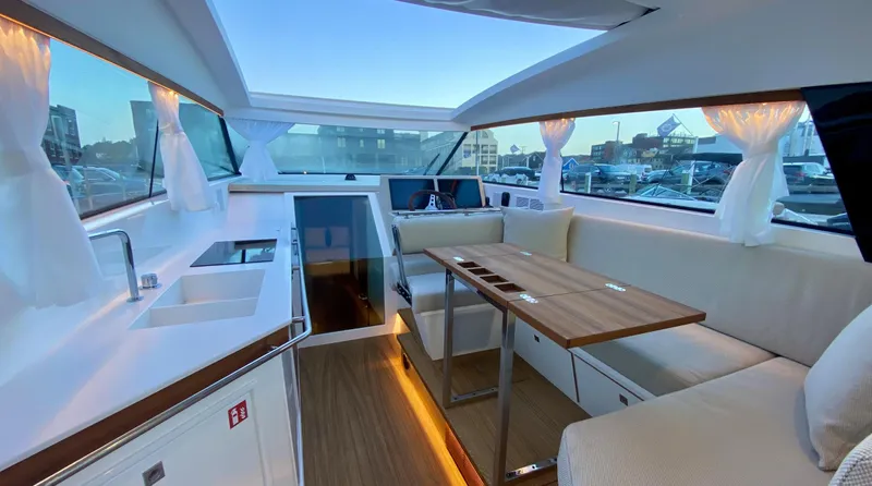  Yacht Photos Pics Interior of 2023 Delta Powerboats 33 Coupe, featuring modern design and spacious seating area.