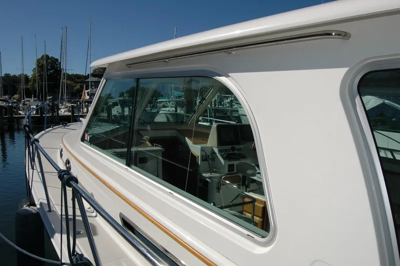 Bonnie Blue Yacht Photos Pics 2015 Back Cove 37 yacht docked, showcasing sleek design and spacious interior.