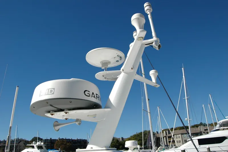 Bonnie Blue Yacht Photos Pics Radar and communication equipment on a 2015 Back Cove 37 boat under clear blue sky.