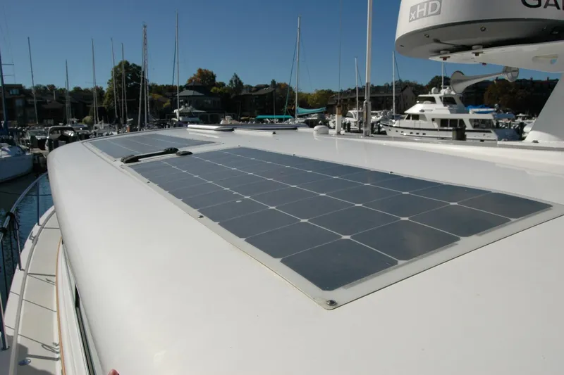Bonnie Blue Yacht Photos Pics 2015 Back Cove 37 yacht with solar panels on deck, docked in marina.
