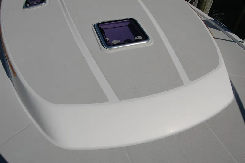 Bonnie Blue Yacht Photos Pics 2015 Back Cove 37 boat deck with hatch, showcasing sleek design and craftsmanship.