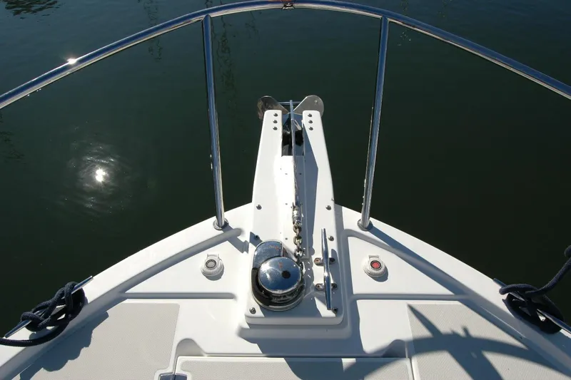 Bonnie Blue Yacht Photos Pics Bow of 2015 Back Cove 37 boat with anchor and railing in sunlight.