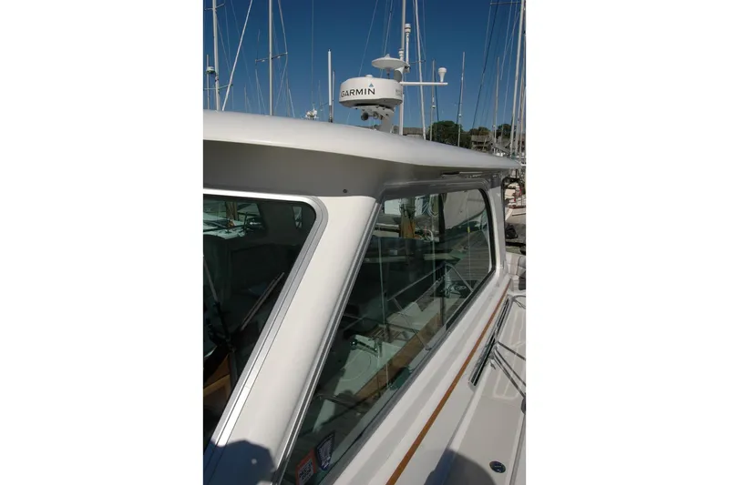 Bonnie Blue Yacht Photos Pics 2015 Back Cove 37 boat with Garmin radar, docked in a marina.
