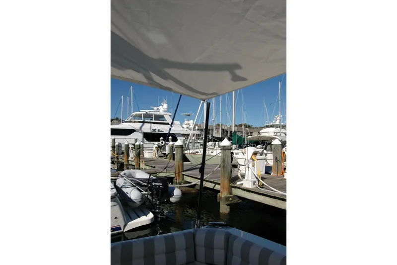 Bonnie Blue Yacht Photos Pics 2015 Back Cove 37 docked at marina with other boats under clear blue sky.