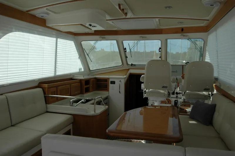 Bonnie Blue Yacht Photos Pics Interior of 2015 Back Cove 37 yacht with seating, helm chairs, and windows.