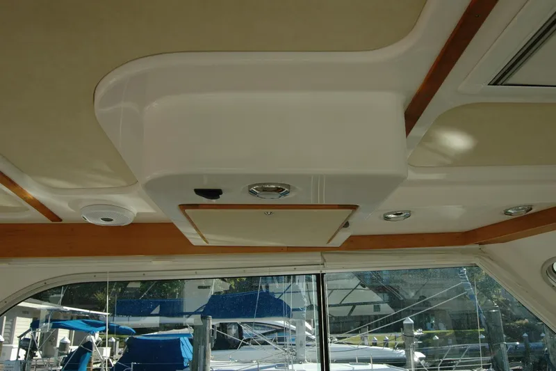 Bonnie Blue Yacht Photos Pics Interior ceiling of a 2015 Back Cove 37 boat with wood accents and lighting fixtures.