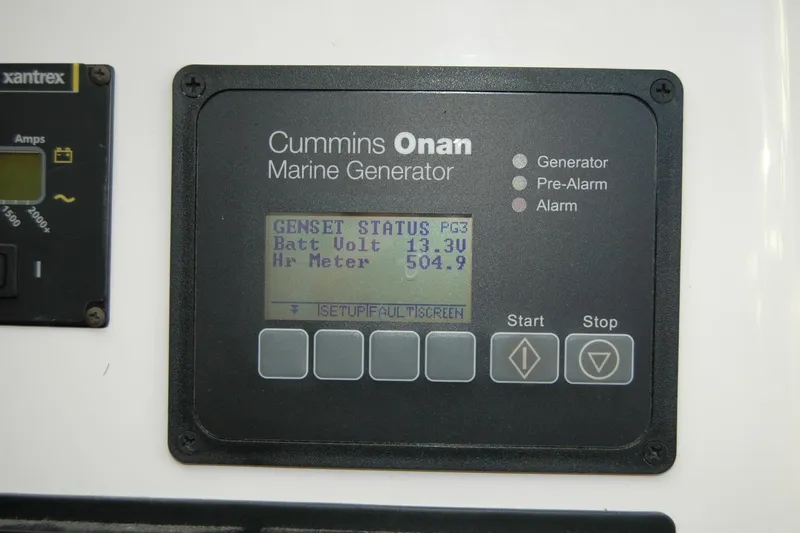 Bonnie Blue Yacht Photos Pics Cummins Onan marine generator display on 2015 Back Cove 37, showing battery voltage and hour meter.