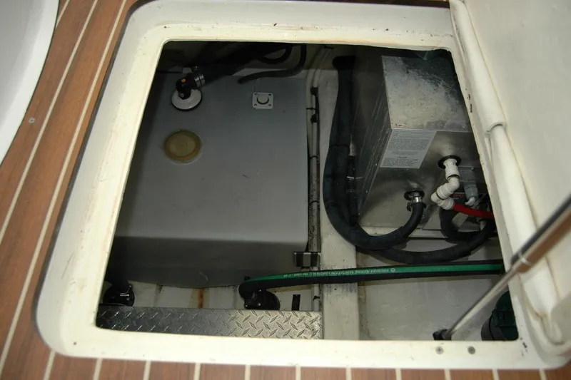 Bonnie Blue Yacht Photos Pics 2015 Back Cove 37 engine compartment with visible fuel tank and hoses.