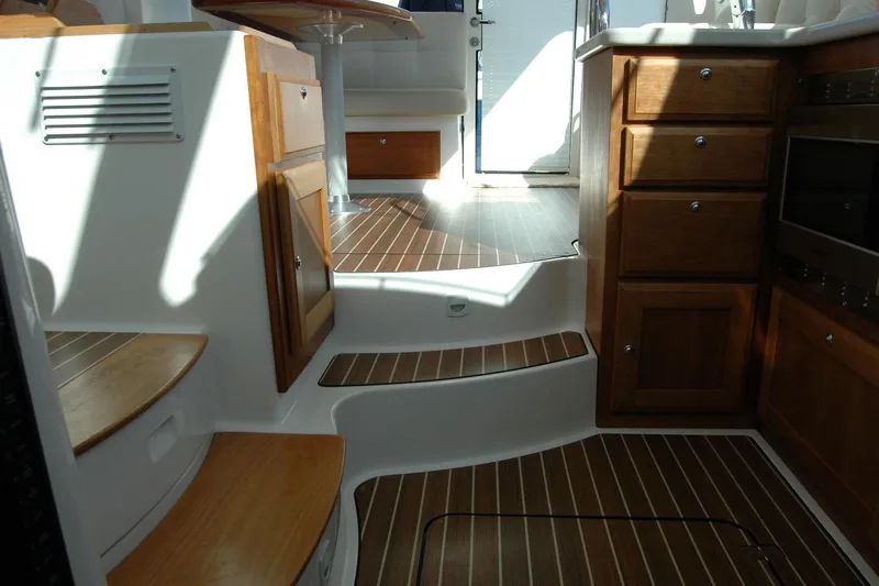 Bonnie Blue Yacht Photos Pics Interior of 2015 Back Cove 37 yacht with wooden cabinetry and steps.