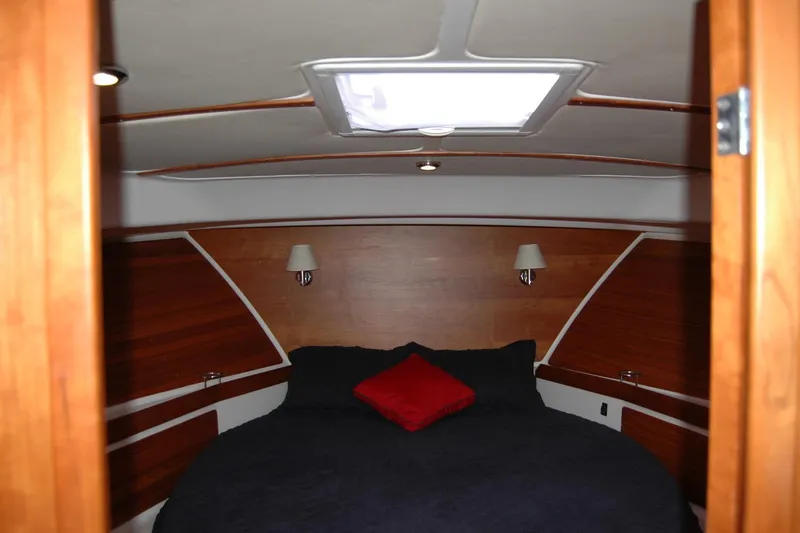 Bonnie Blue Yacht Photos Pics Cozy cabin interior of 2015 Back Cove 37 yacht with wood paneling and skylight.
