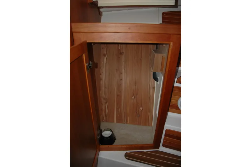 Bonnie Blue Yacht Photos Pics 2015 Back Cove 37 interior wooden cabinet with open door.