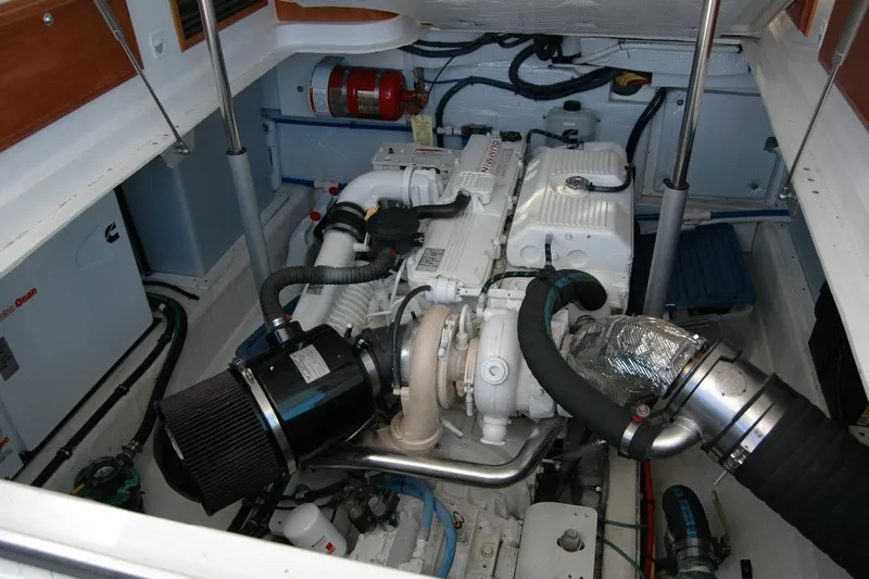 Bonnie Blue Yacht Photos Pics Engine compartment of a 2015 Back Cove 37 boat, showcasing mechanical components.