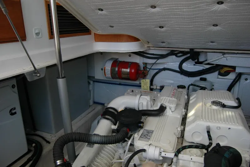 Bonnie Blue Yacht Photos Pics Engine room of 2015 Back Cove 37 boat with visible fire extinguisher and Cummins engine.