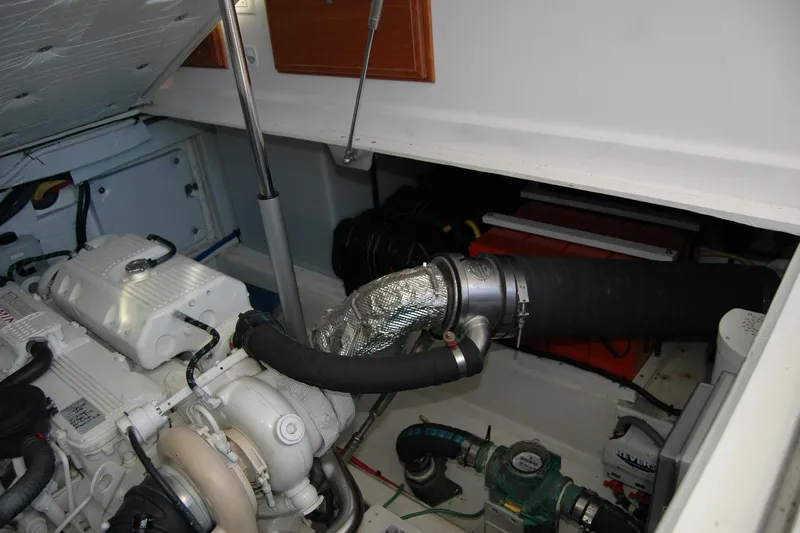 Bonnie Blue Yacht Photos Pics Engine compartment of a 2015 Back Cove 37 boat, showcasing mechanical components.