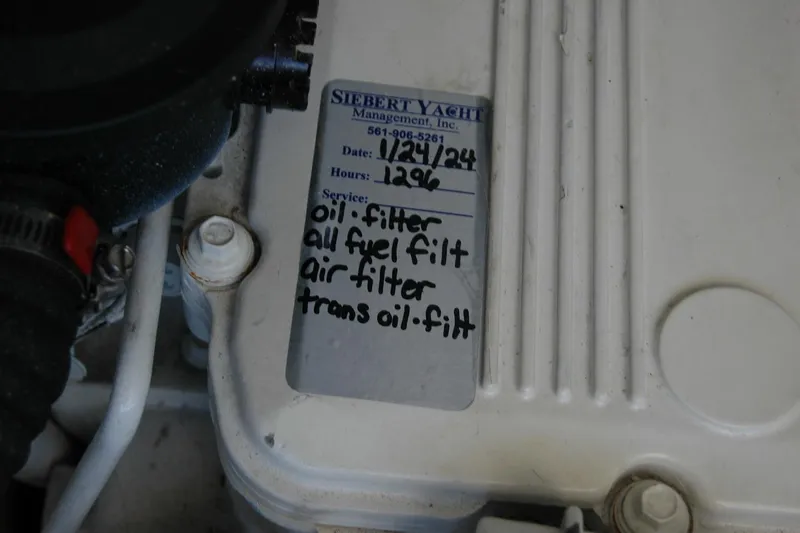 Bonnie Blue Yacht Photos Pics Maintenance label on a 2015 Back Cove 37 engine, listing filter services.