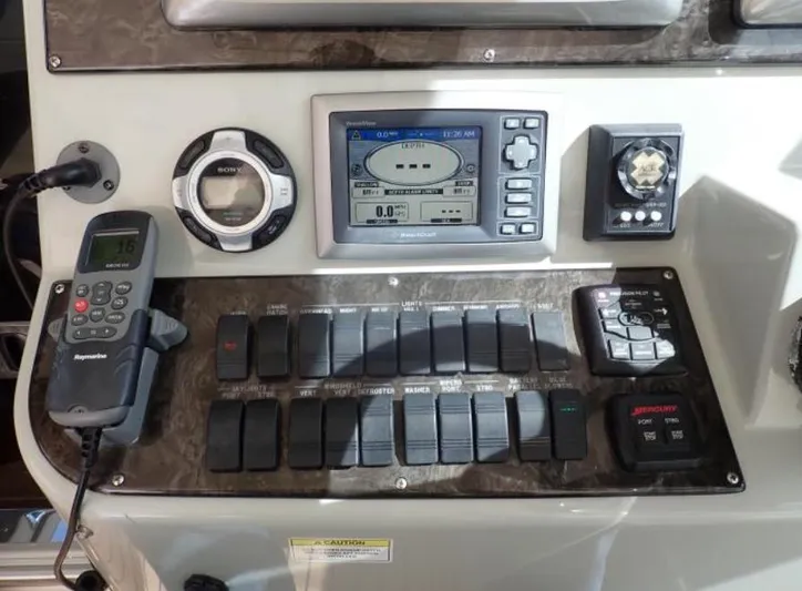Fiddle Deedee Yacht Photos Pics Control panel of a 2011 Sea Ray Sundancer boat with navigation and communication equipment.