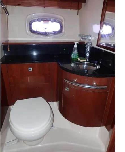 Fiddle Deedee Yacht Photos Pics 2011 Sea Ray Sundancer bathroom with sink, toilet, and porthole window.