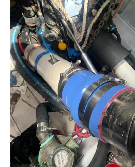 Fiddle Deedee Yacht Photos Pics Engine compartment of a 2011 Sea Ray Sundancer boat with visible hoses and components.