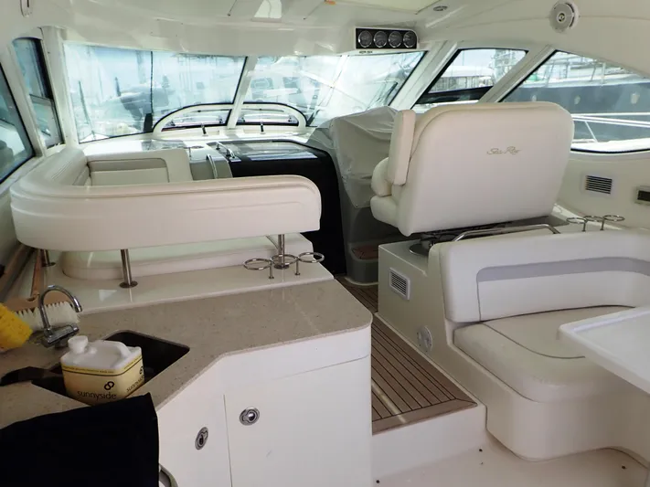 Fiddle Deedee Yacht Photos Pics Interior of 2011 Sea Ray Sundancer yacht with seating and helm.