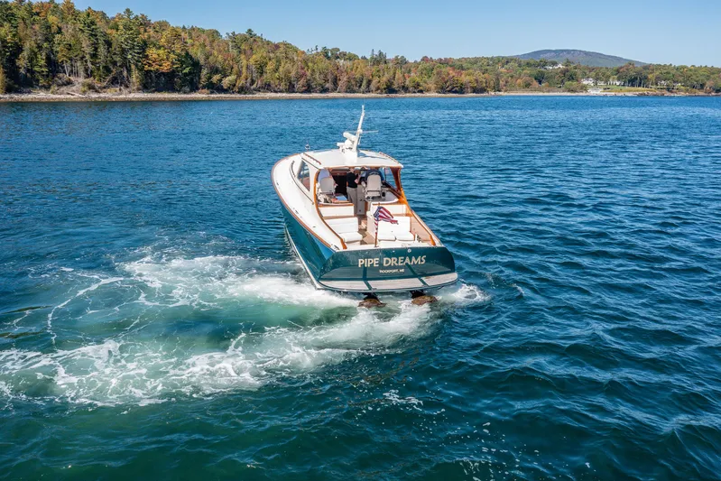 Pipe Dreams Yacht Photos Pics Hinckley Talaria 44 Express yacht cruising on a scenic lake, 2002 model.