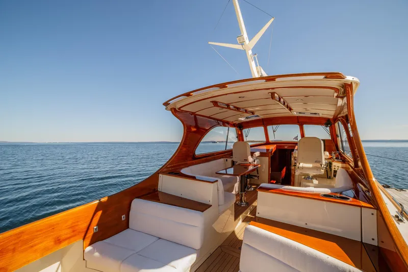 Pipe Dreams Yacht Photos Pics 2002 Hinckley Talaria 44 Express yacht interior with elegant seating and ocean view.