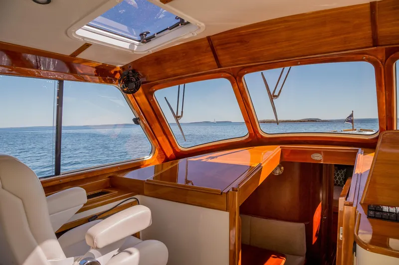 Pipe Dreams Yacht Photos Pics Interior view of 2002 Hinckley Talaria 44 Express yacht with ocean backdrop.